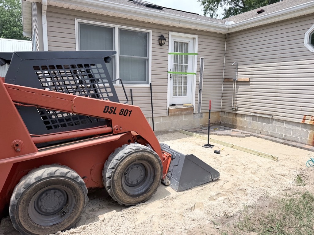 Murray Brothers skid-steer excavating and grading a residential site